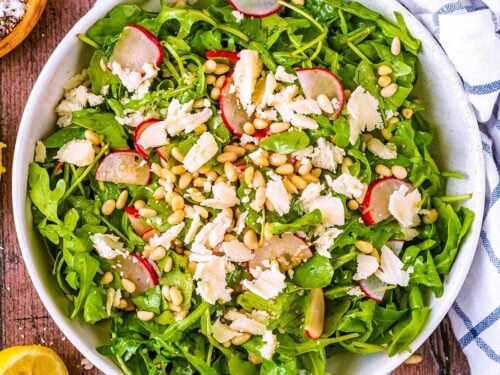 Rocket salad in a large serving bowl.