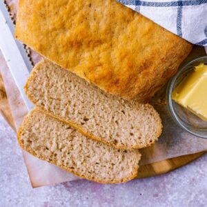 Slow cooker bread with two slices cut off.