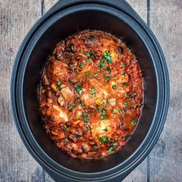 Slow cooker chicken chasseur in a slow cooker bowl.