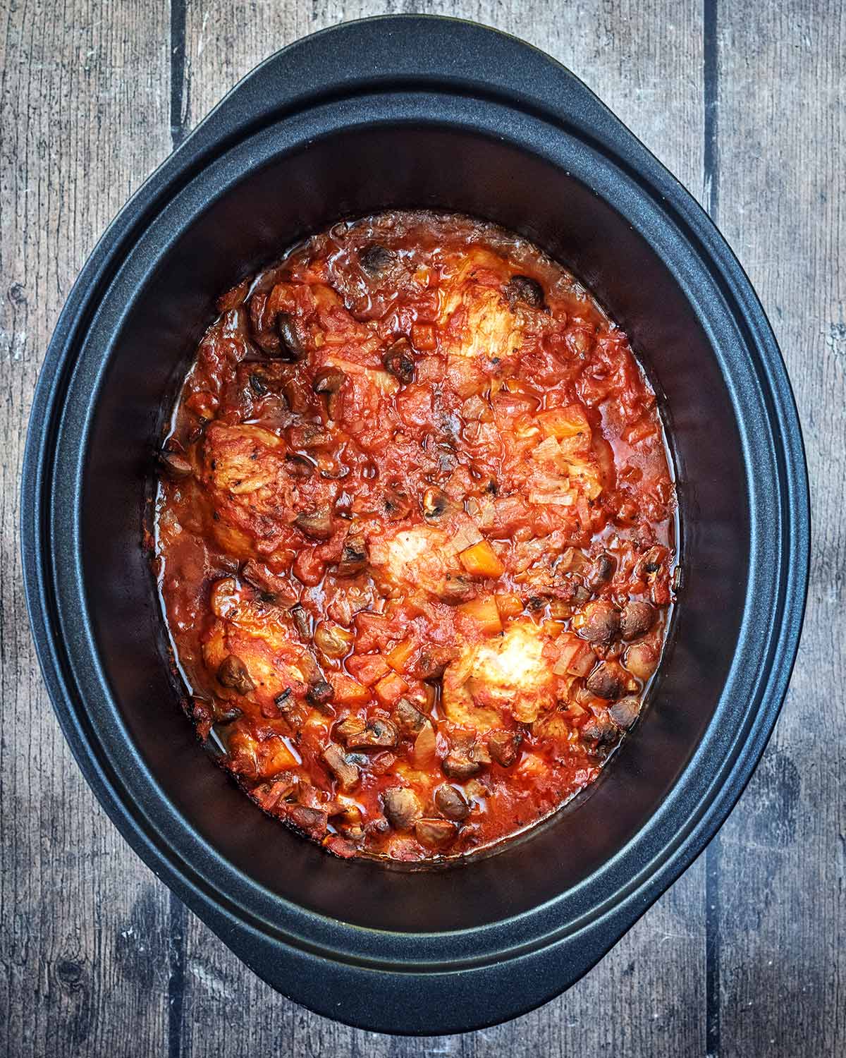 Cooked chicken chasseur in the slow cooker.