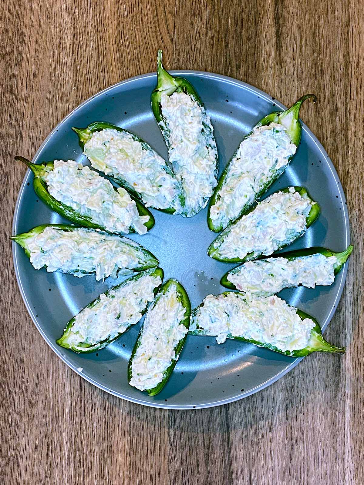 Ten jalapeno halves filled with cream cheese mixture.