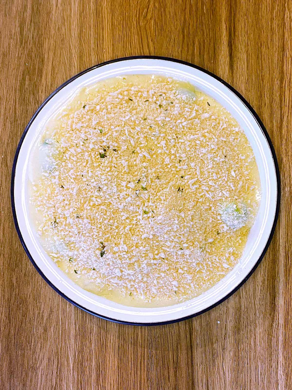 Breadcrumbs sprinkled over the top of the cheese sauce.