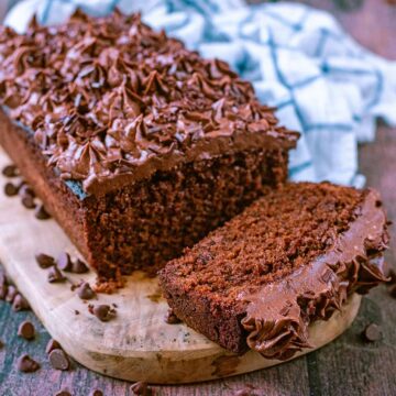 Chocolate loaf cake on a wooden board.