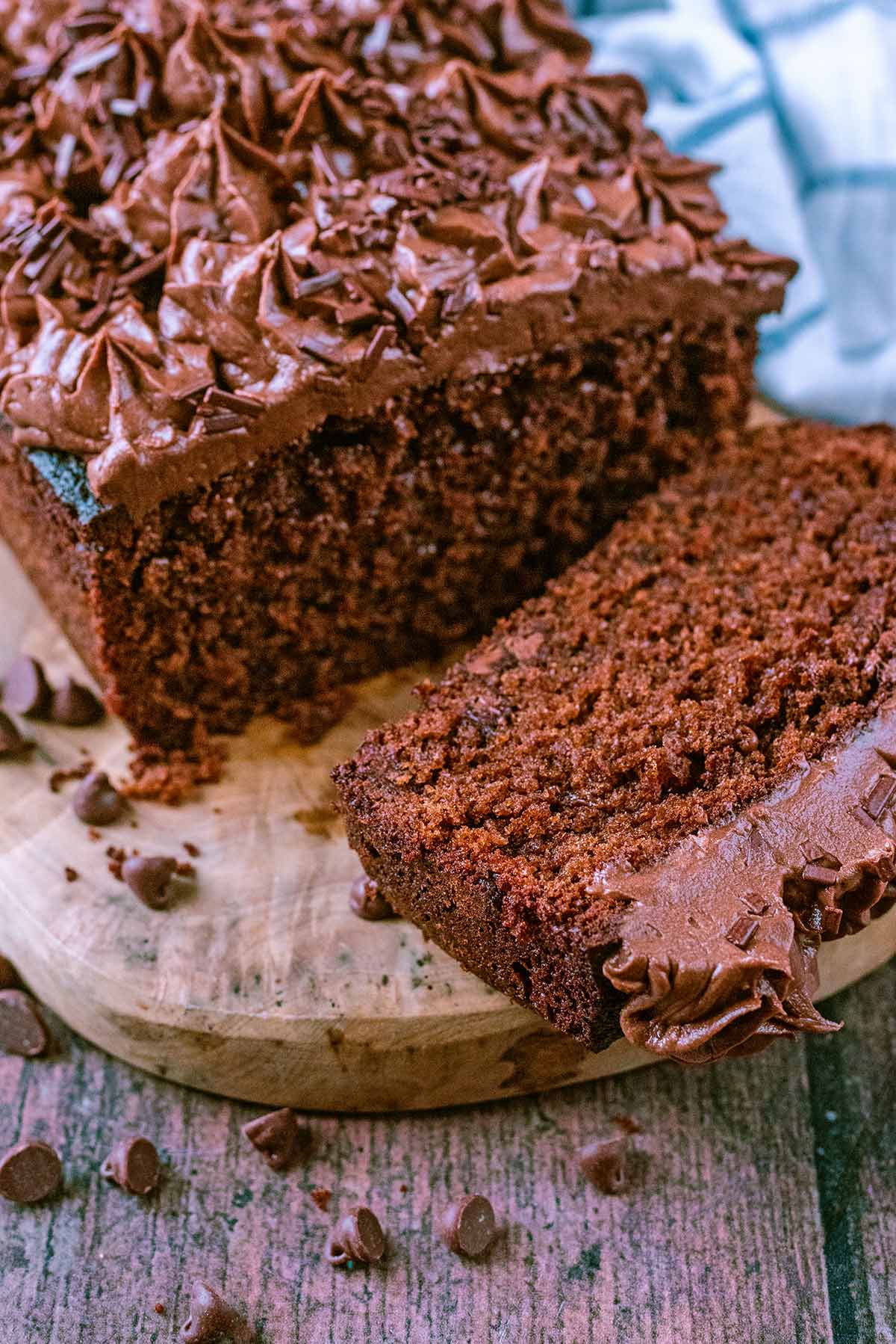 Chocolate loaf cake with a slice cut off.