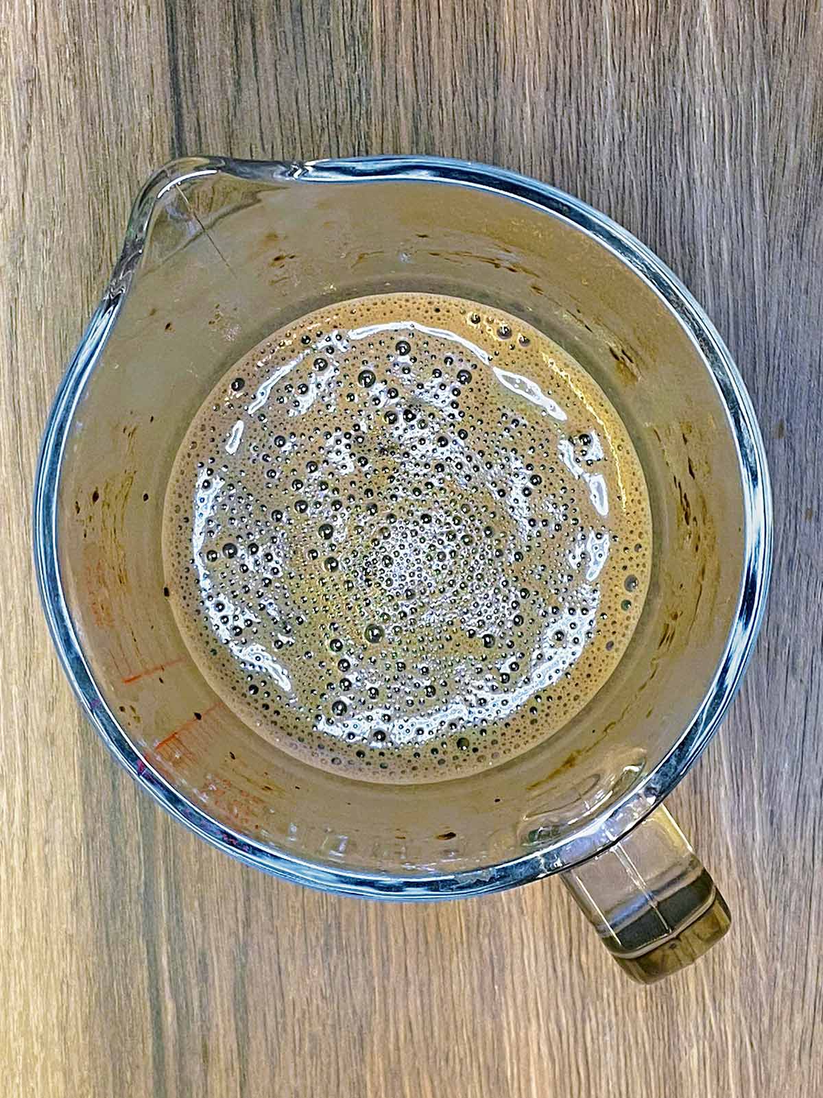 Hot chocolate in a glass jug.