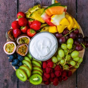 A fruit platter on a wooden surface.