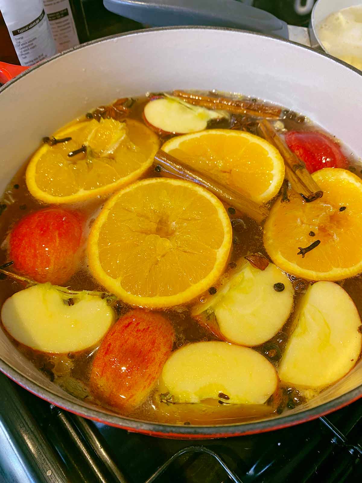 Mulled cider simmering on a hob.