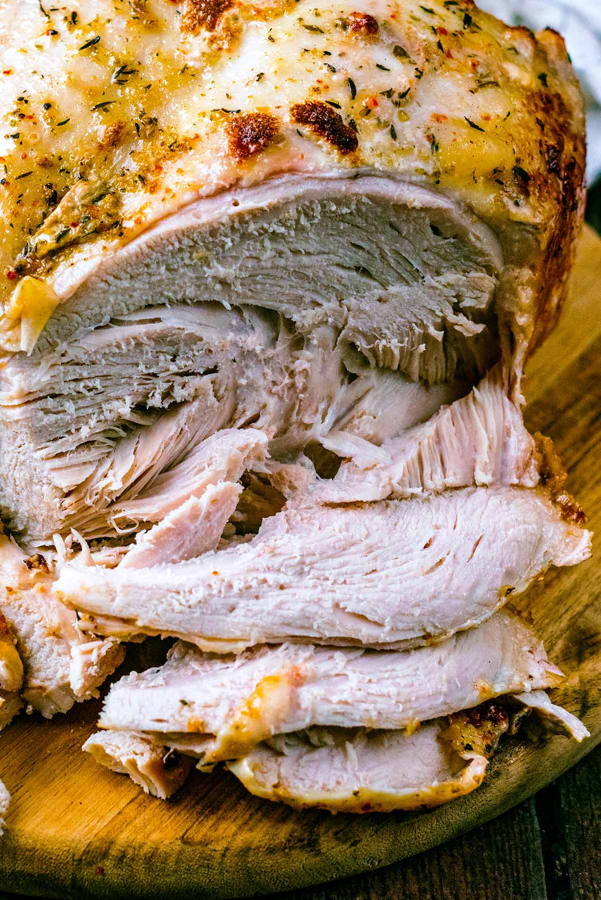 Slices of turkey falling away from the breast.