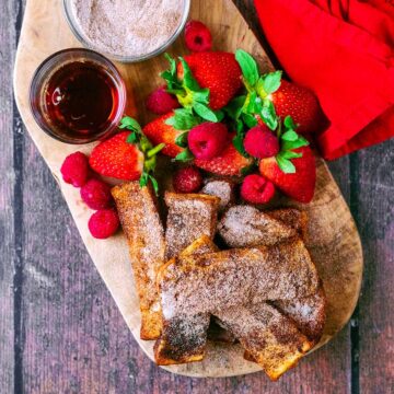 Air Fryer French Toast on a wooden serving board.
