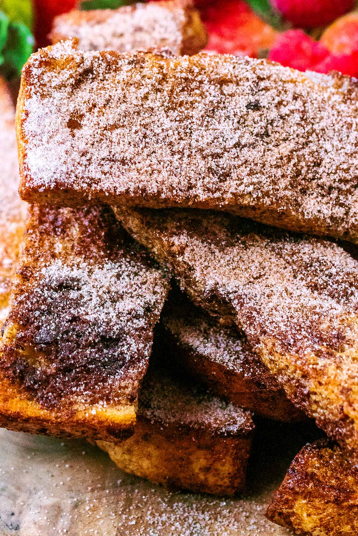 Slices of French toast topped with cinnamon and sugar.