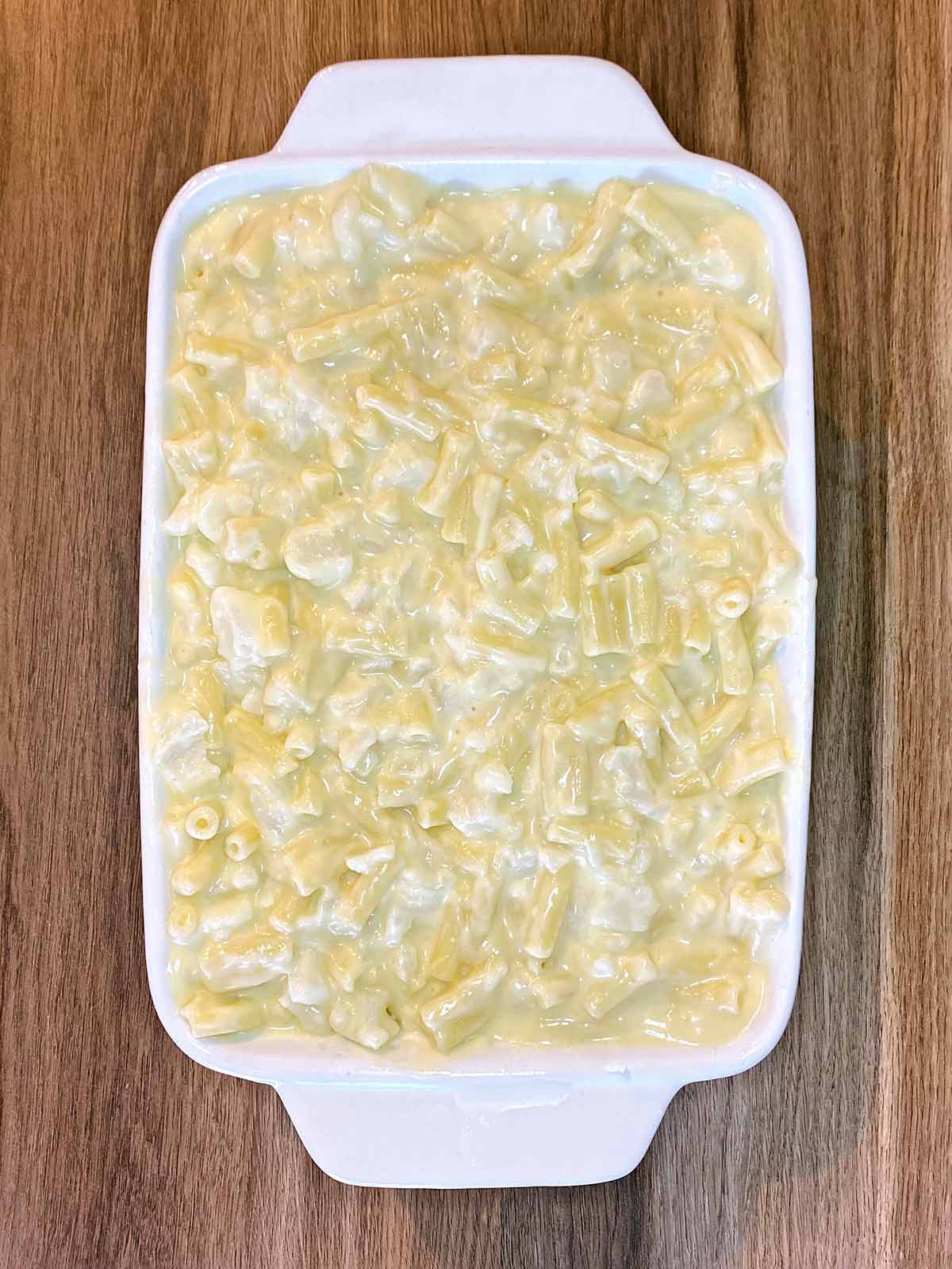 Cheese sauce added to the baking dish.