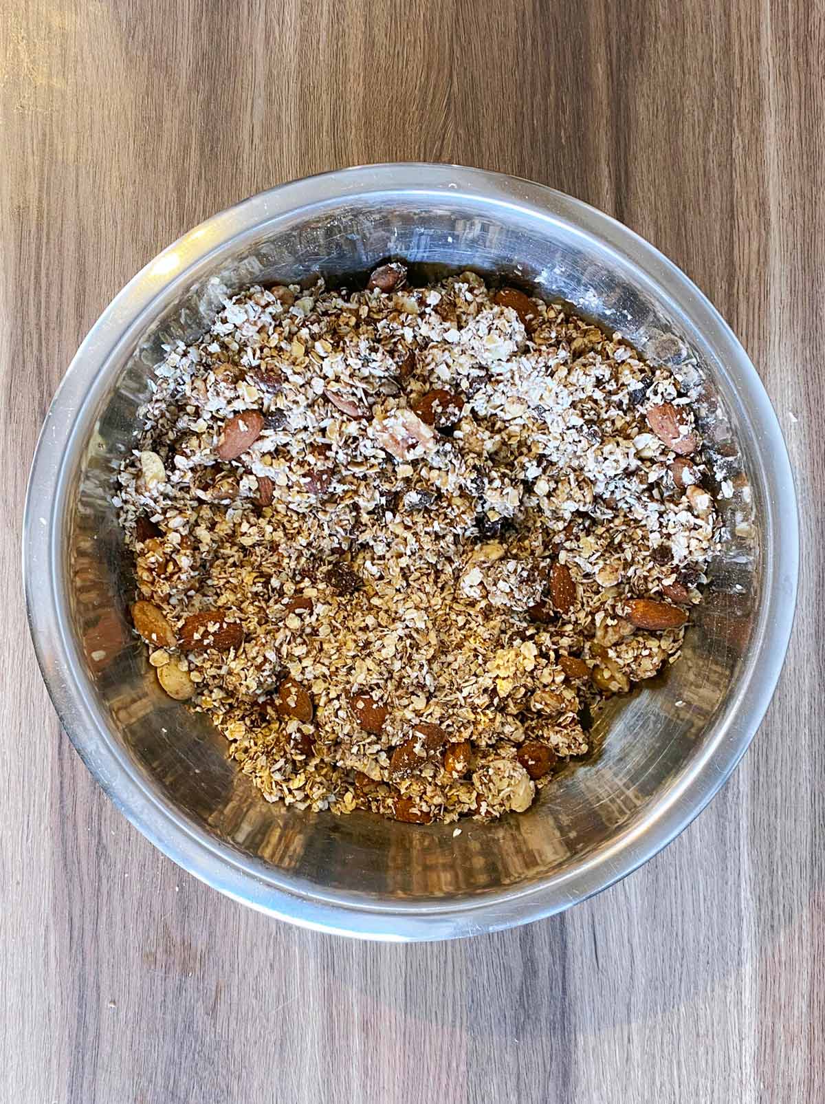 A bowl of granola ingredients all mixed together.