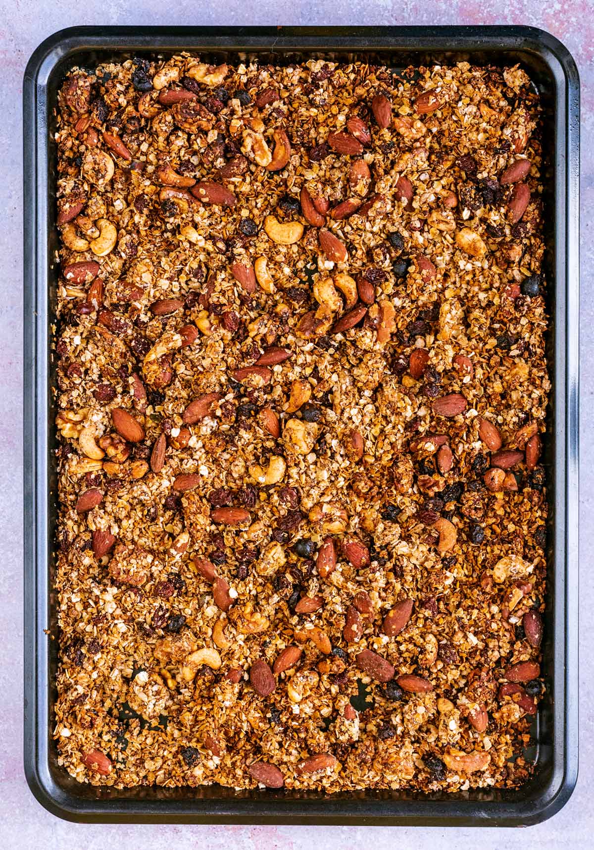 Cooked granola on a baking tray.