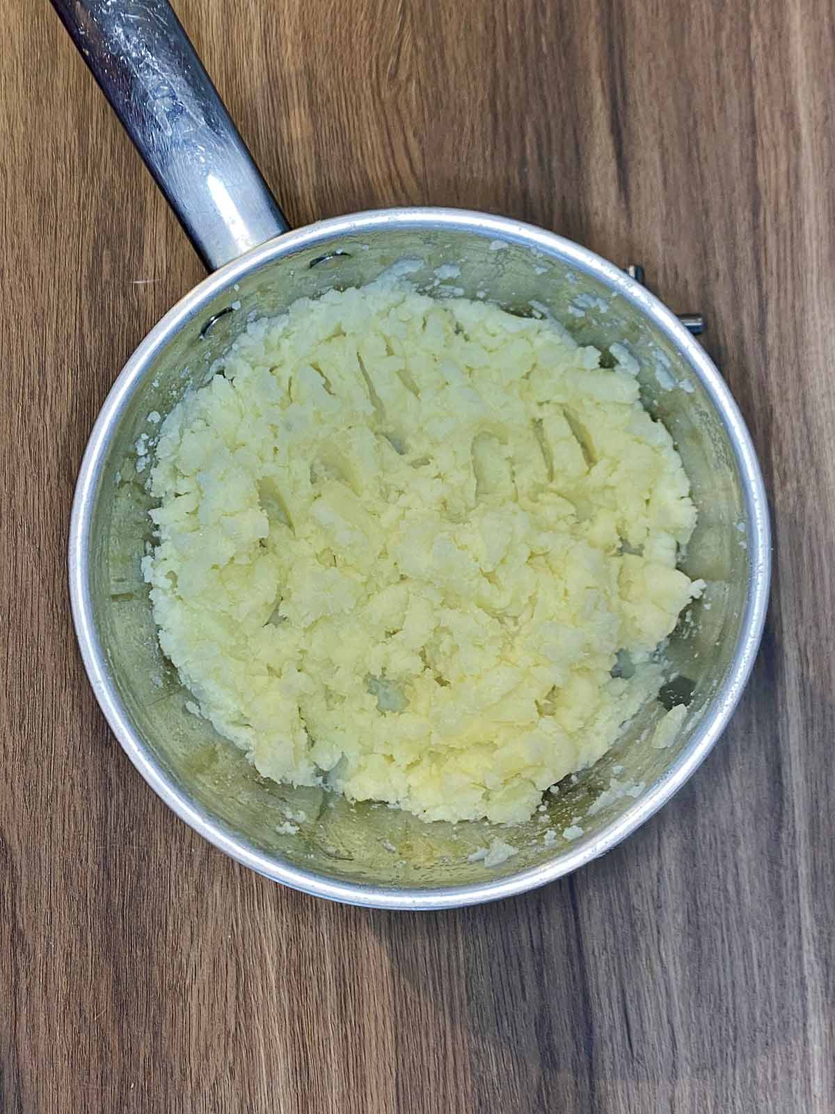 Mashed potato in a saucepan.