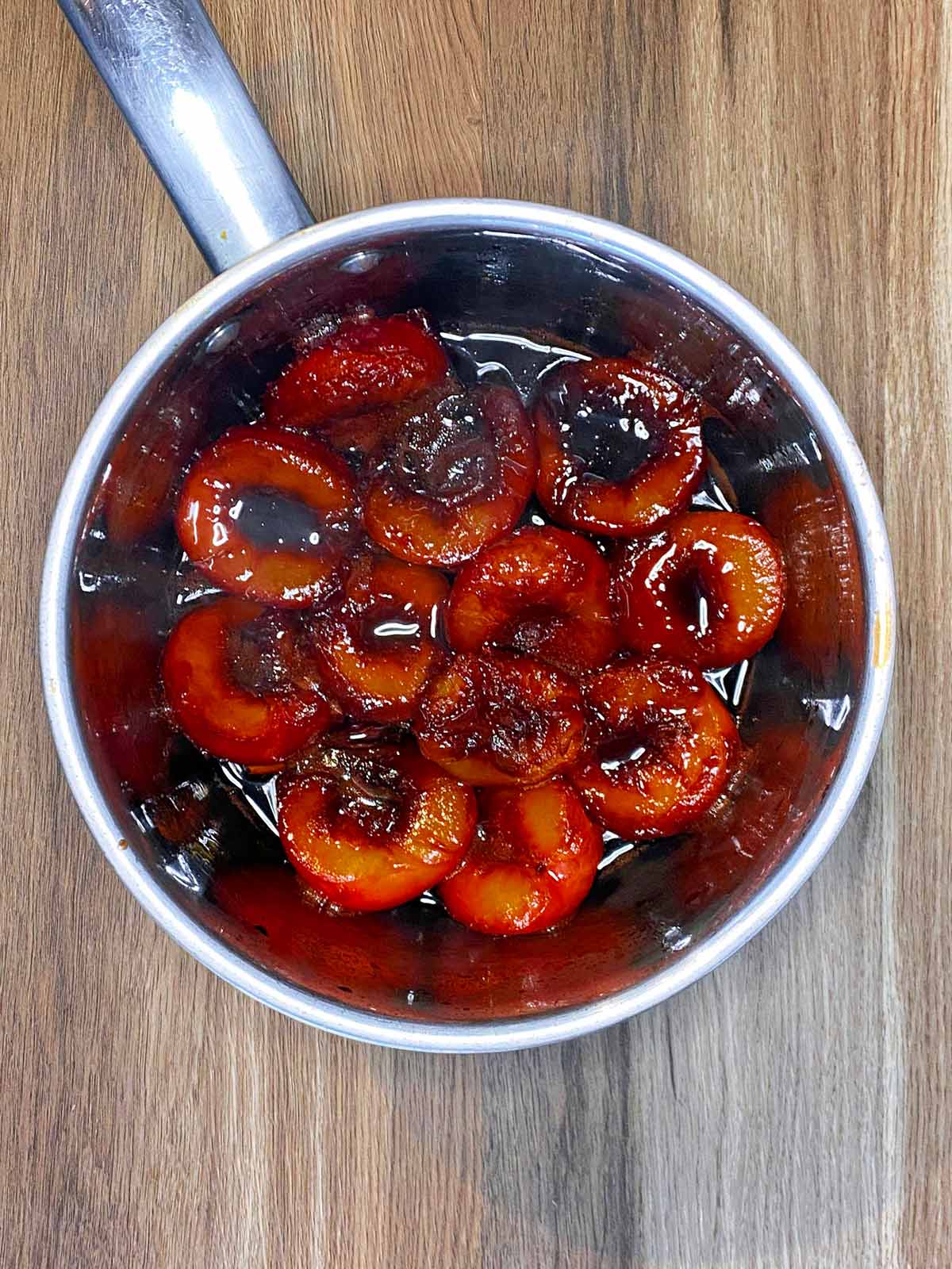 Plums that have stewed down in a syrup.