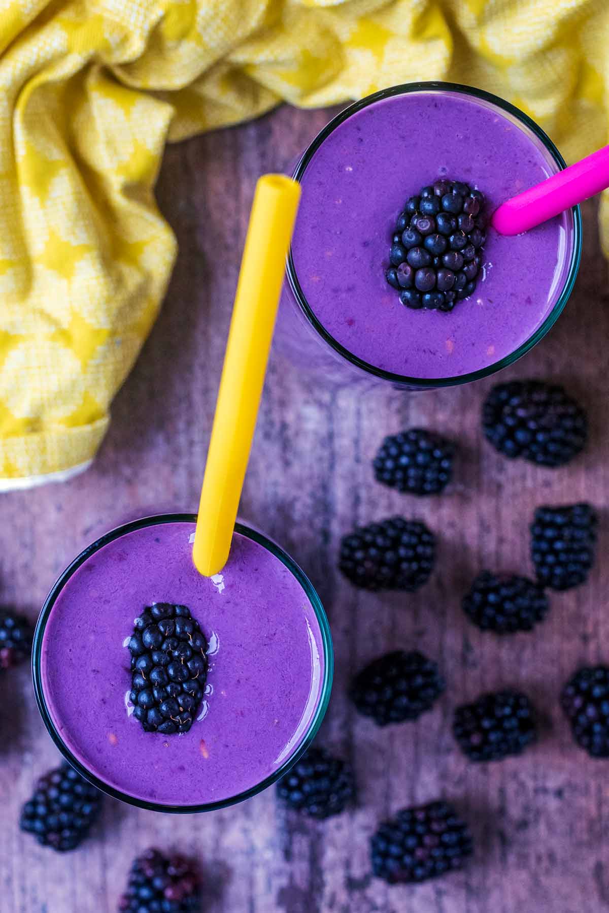 Two purple smoothies as viewed from above.