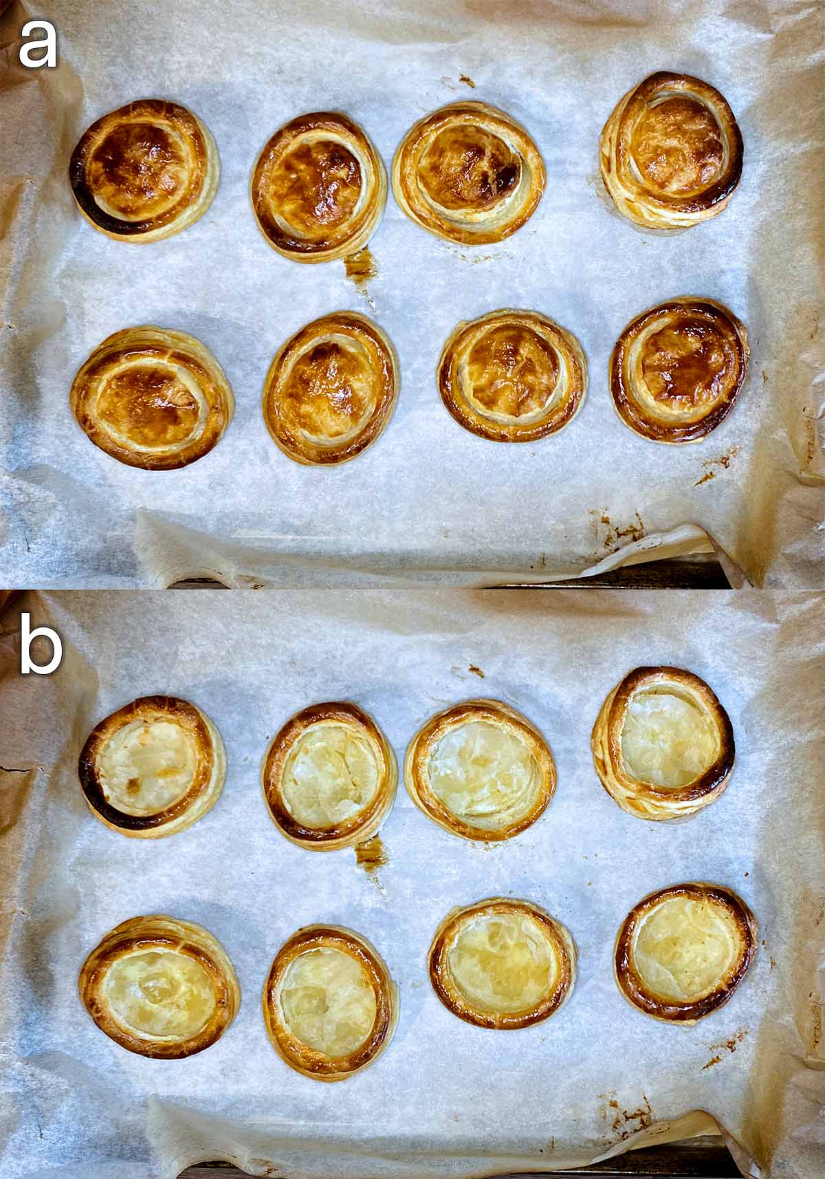 Cooked vol au vent cases on a lined baking tray.