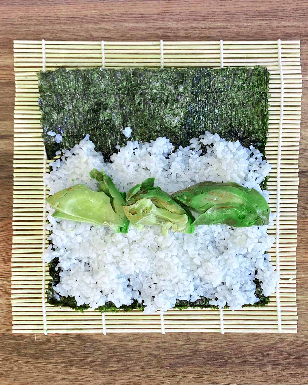 Sliced avocado added on top of the rice.