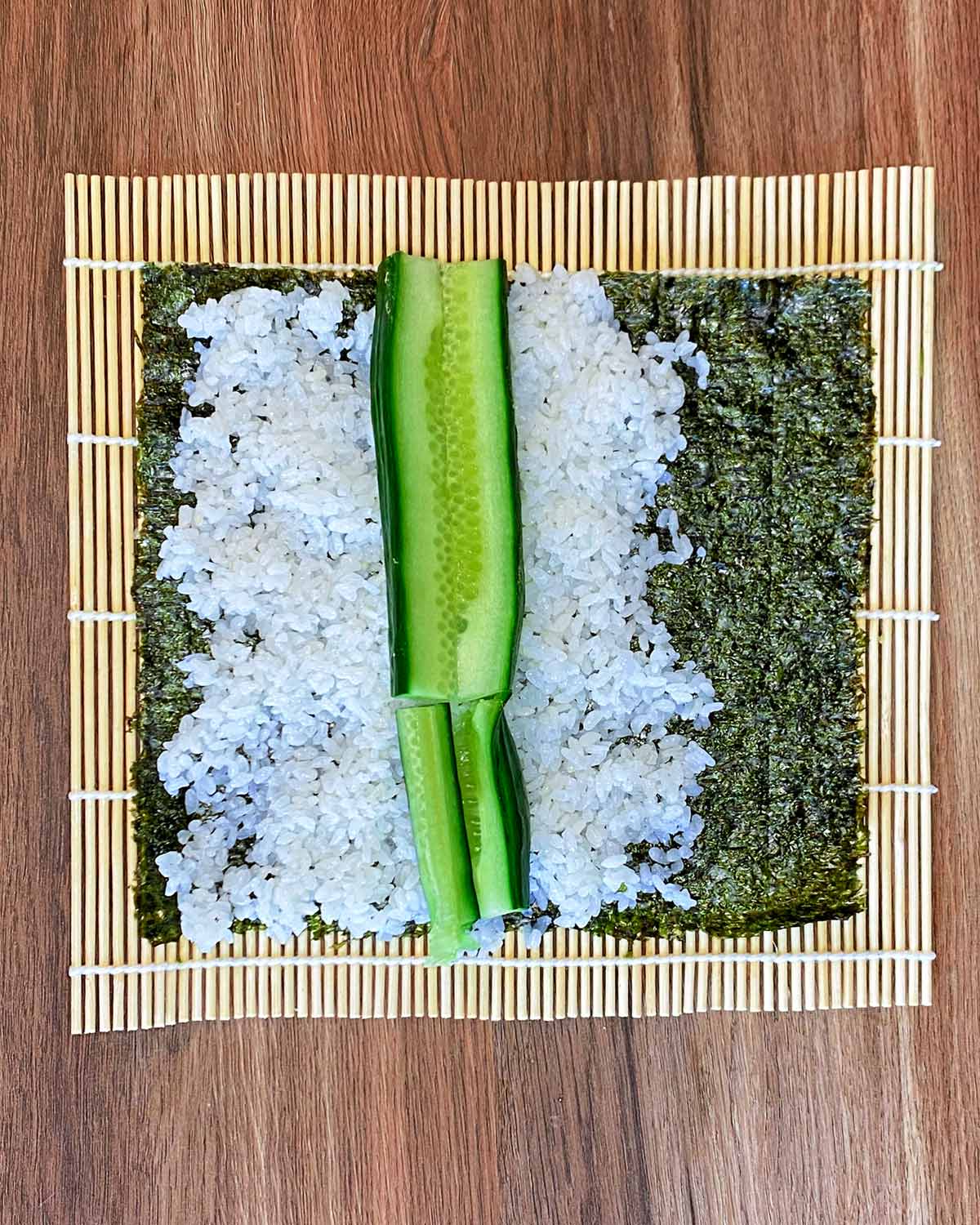 Strips of cucumber laid on top of the rice.