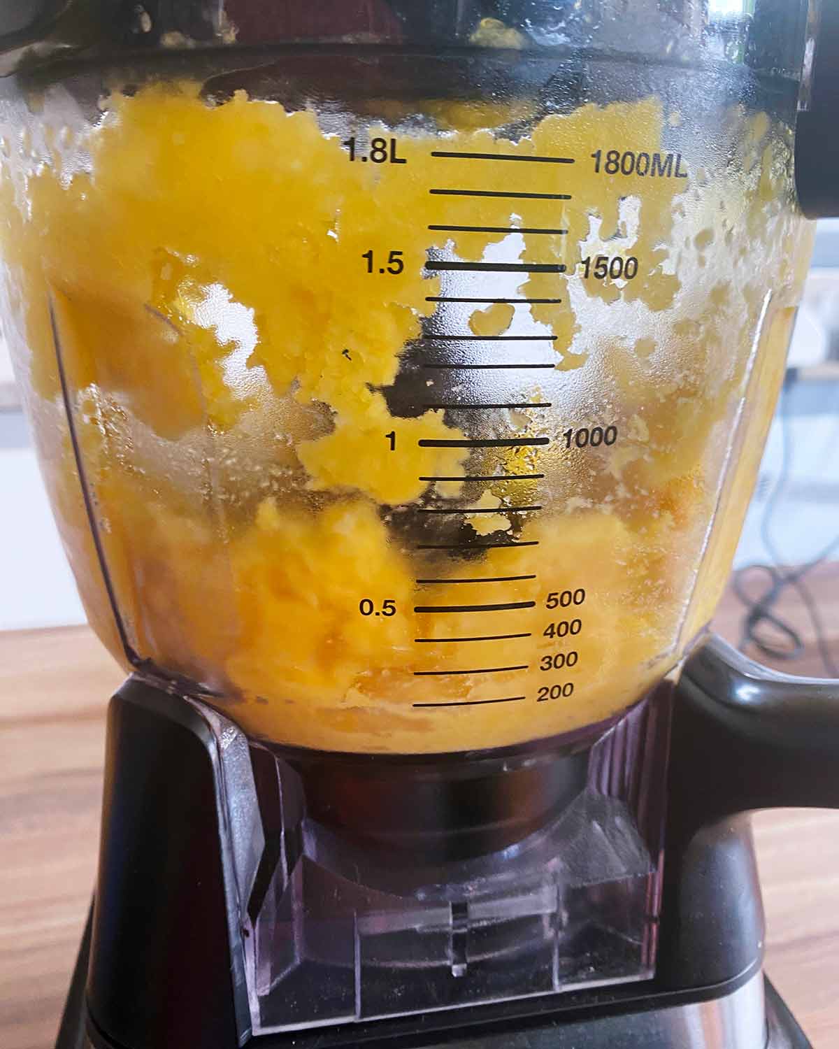 Blended mango in a food processor.