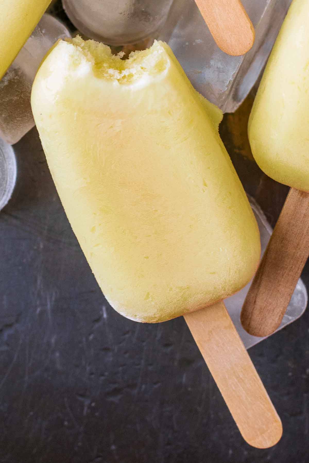 An ice lolly with a bite taken out of it.