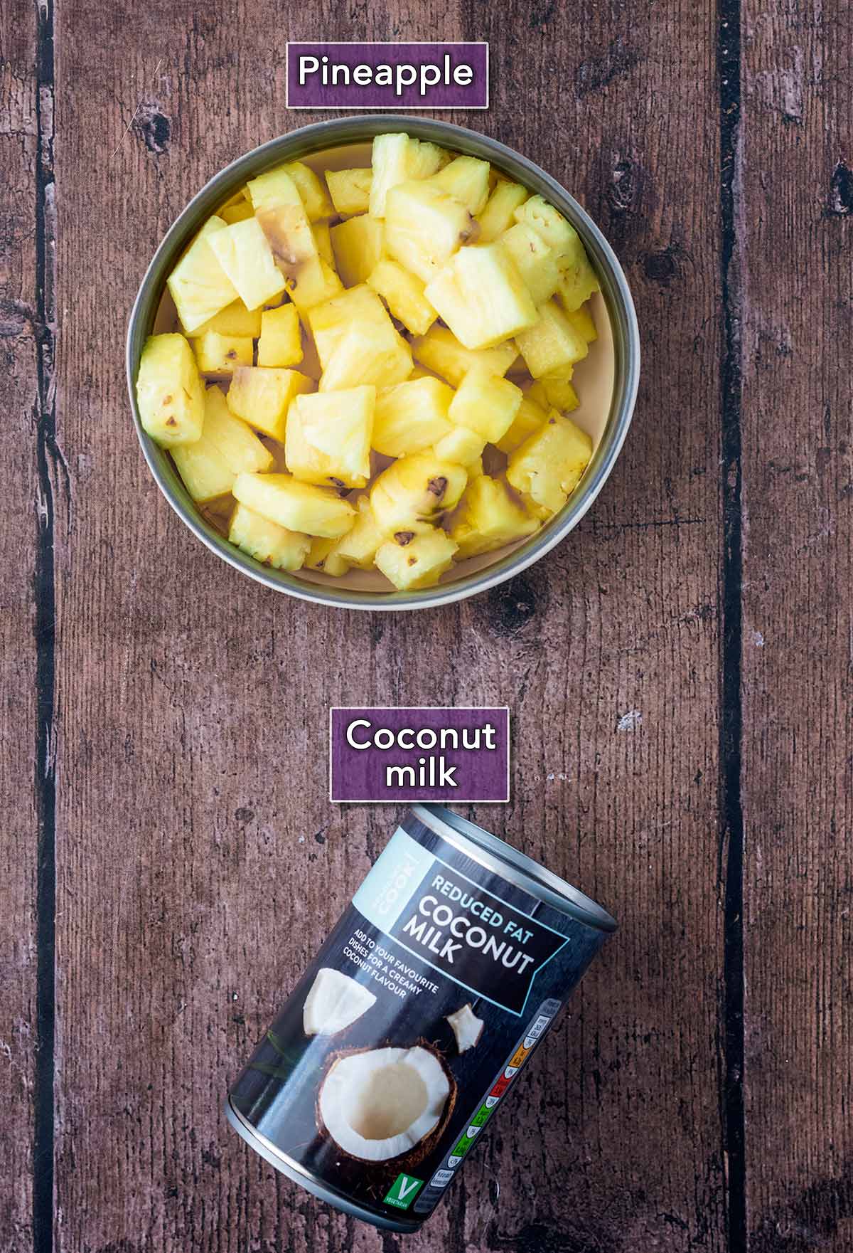 Pineapple chunks in a bowl and a can of coconut milk, both with labels.