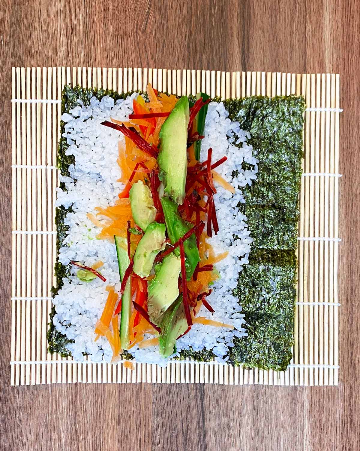 Strips of vegetables laid on top of the rice.