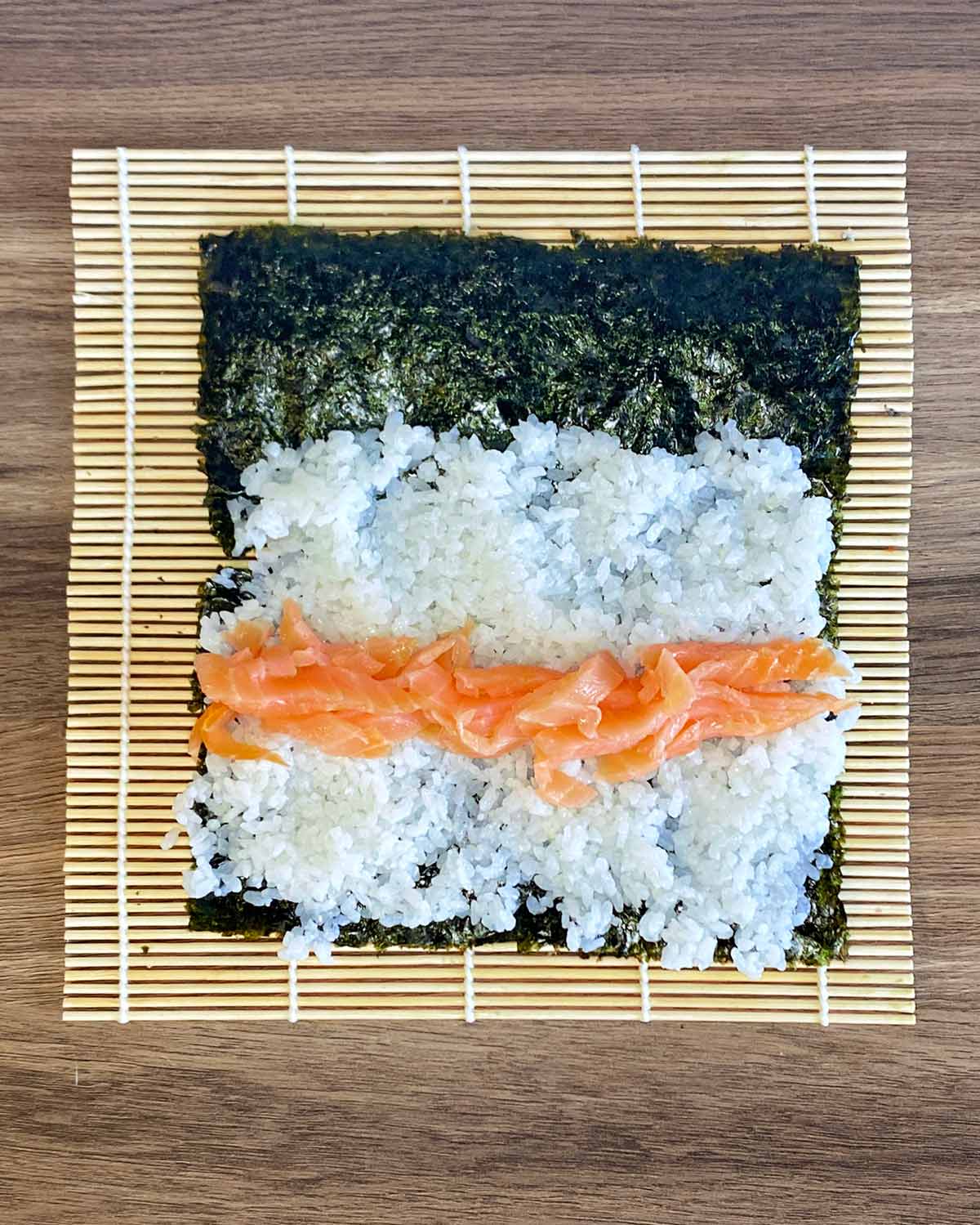 Smoked salmon laid across the centre of the rice.