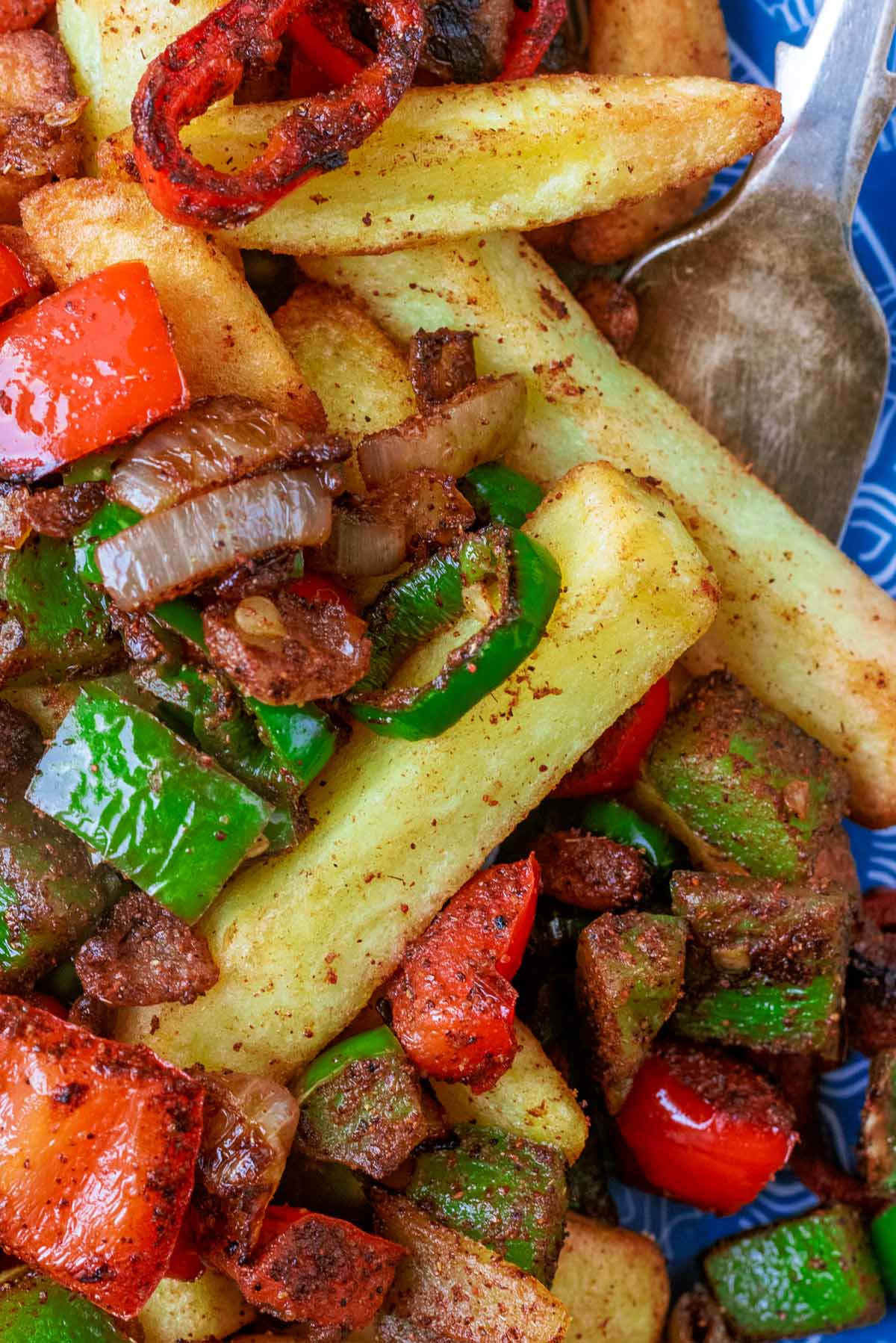 Cooked chips mixed with peppers, onions and chillies.