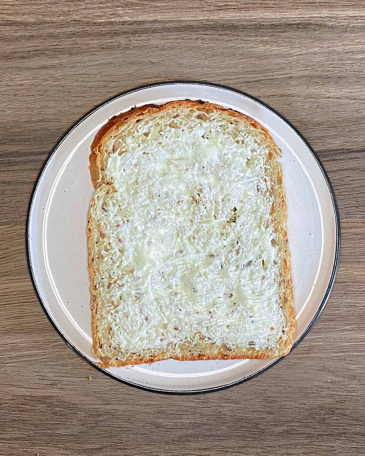 A slice of buttered bread.
