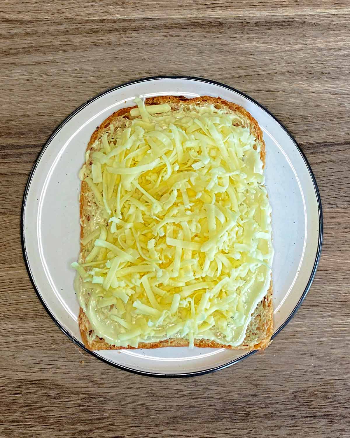 Grated cheese added to the bread.