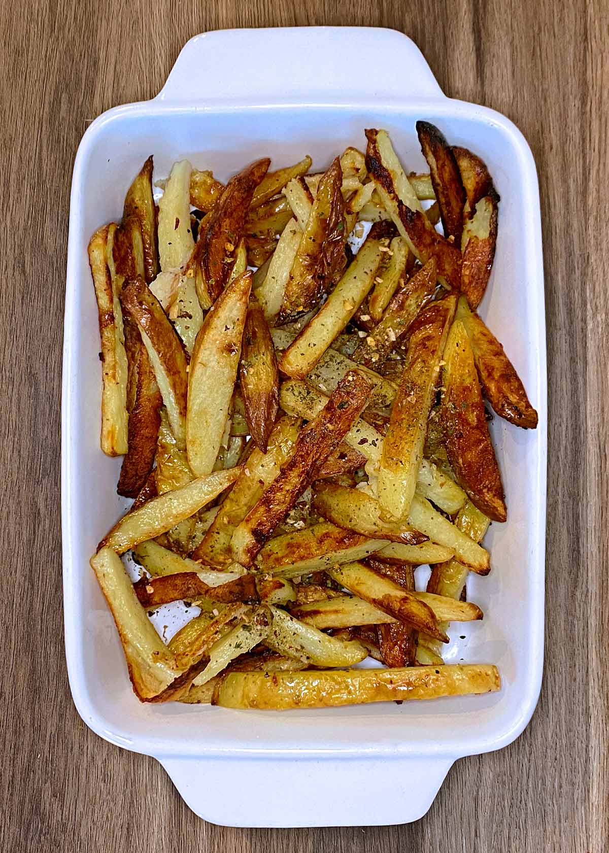 Cooked chips in a rectangular baking dish.