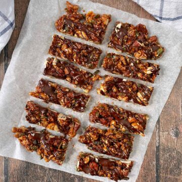 Homemade Kind Nut Bars on a sheet of baking paper.