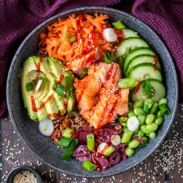 Salmon Rice Bowl on a wooden surface.