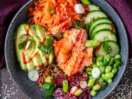 Salmon Rice Bowl on a wooden surface.