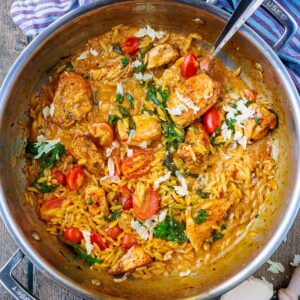 Creamy chicken orzo in a large silver pan.