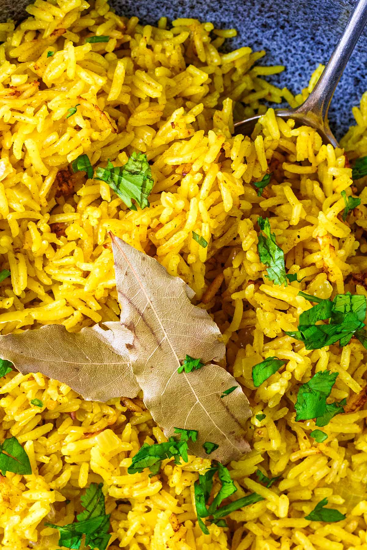 Two bay leaves sat on top of some pilau rice.
