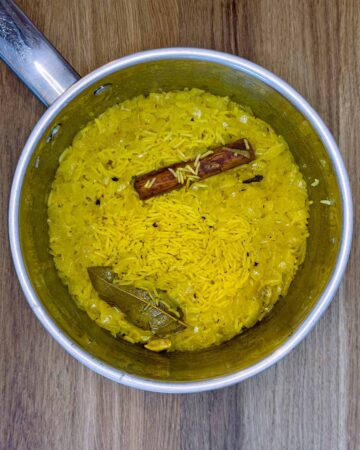Cooked pilau rice in the pan.