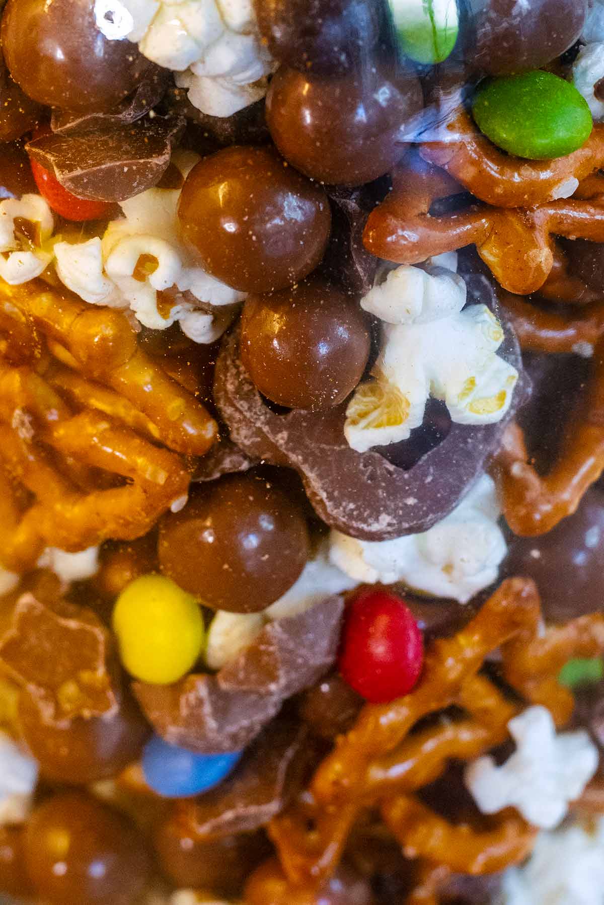 Maltesers, Smarties and chocolate stars, mixed into popcorn and pretzels.