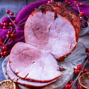 Air fryer gammon joint with two slices cut off.