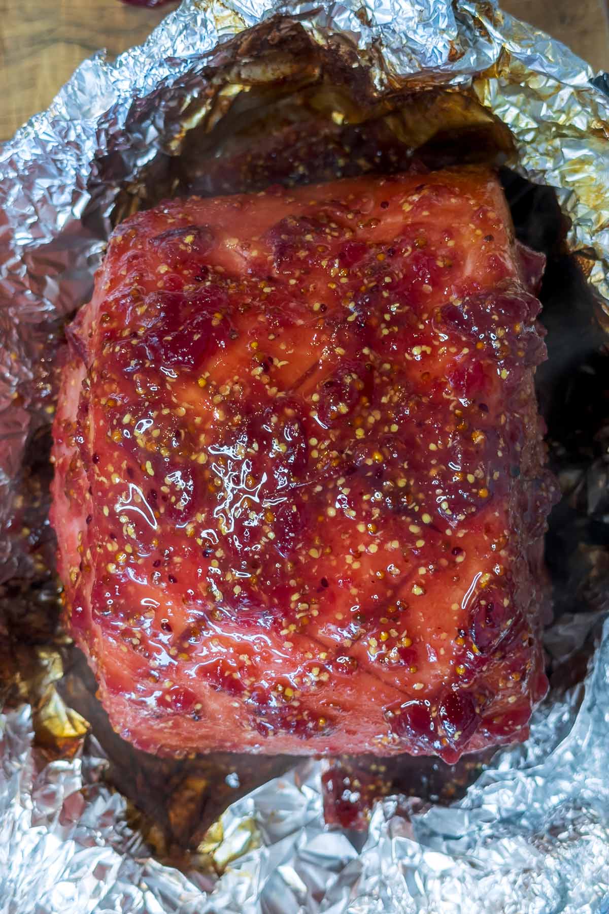 Cranberry glaze on top of the scored gammon.