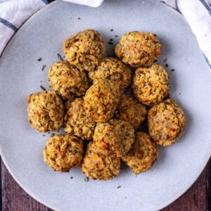 Air fryer stuffing balls on a round plate.