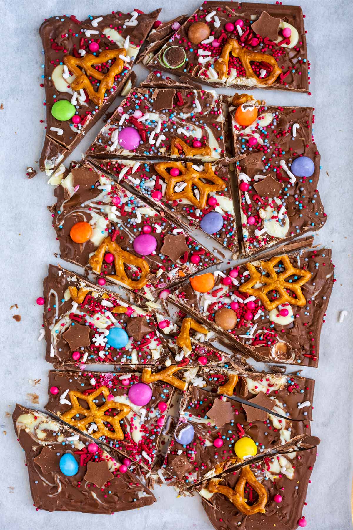 A slab of decorated chocolate cut into shards.