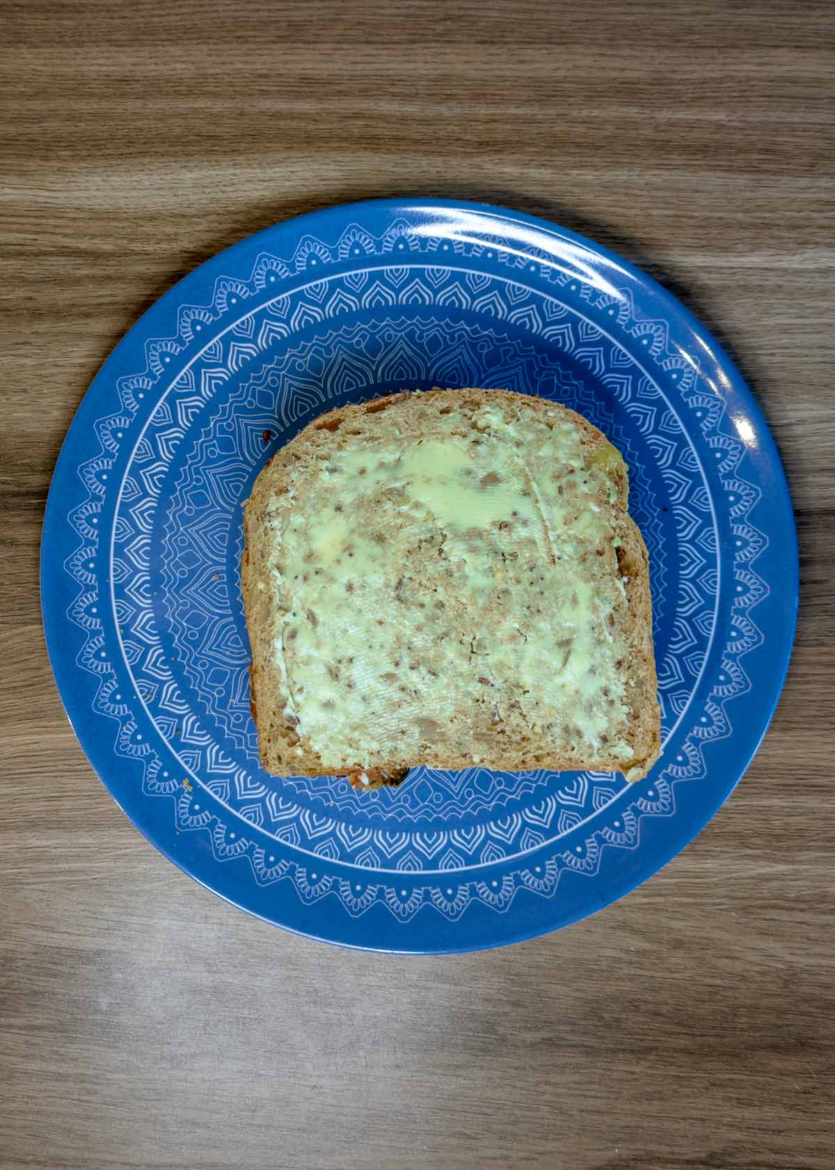 Another slice of buttered bread added on top.