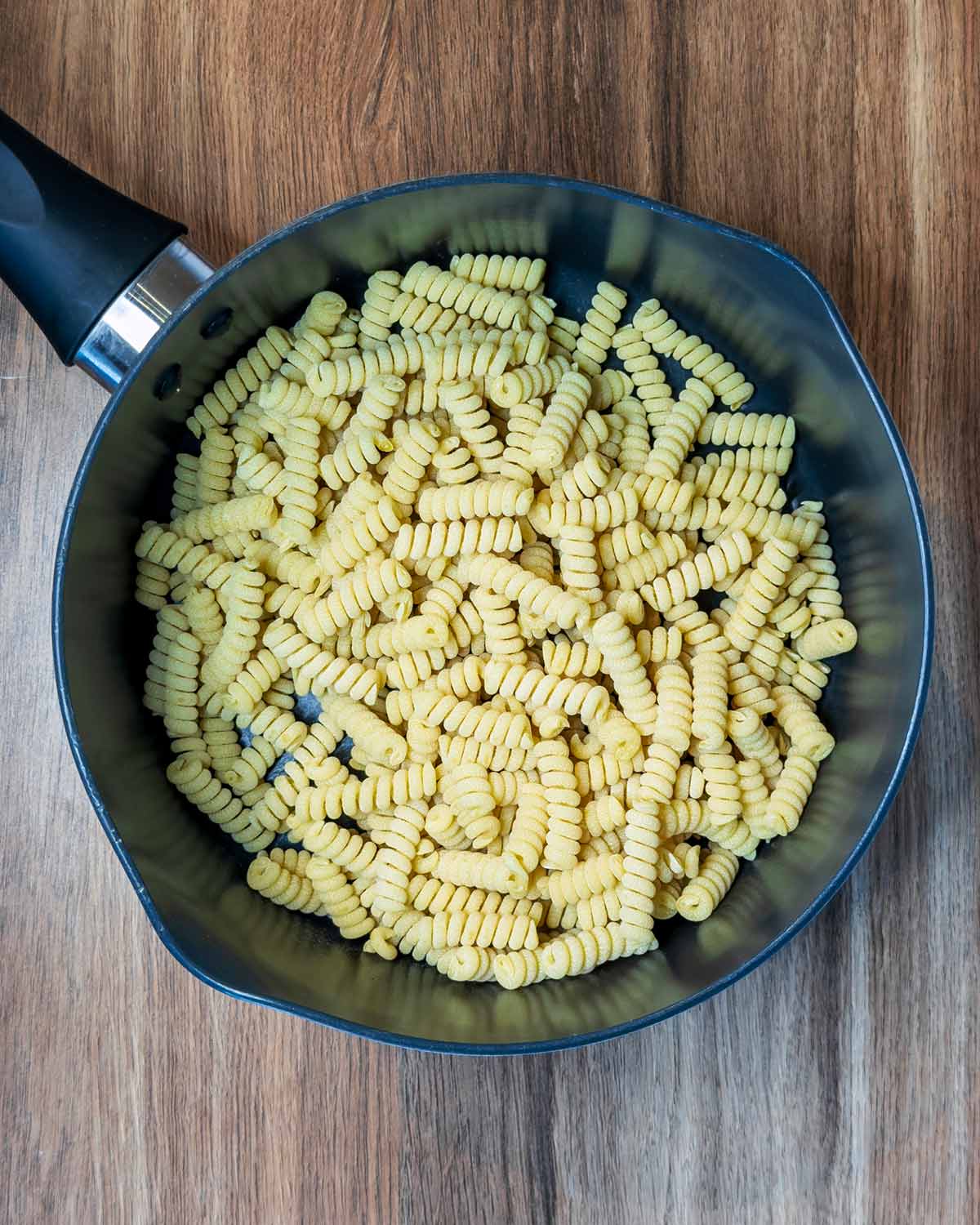 Pasta shapes in a saucepan.