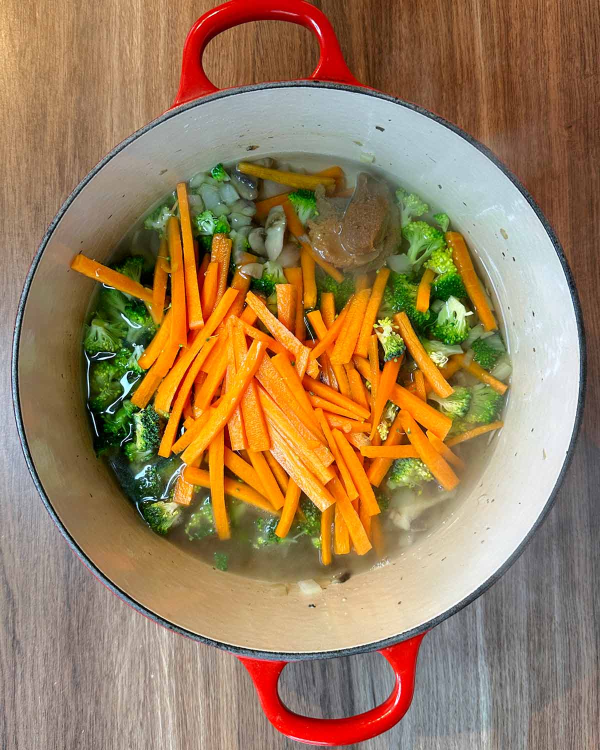 Carrots, broccoli and miso paste added to the pan.