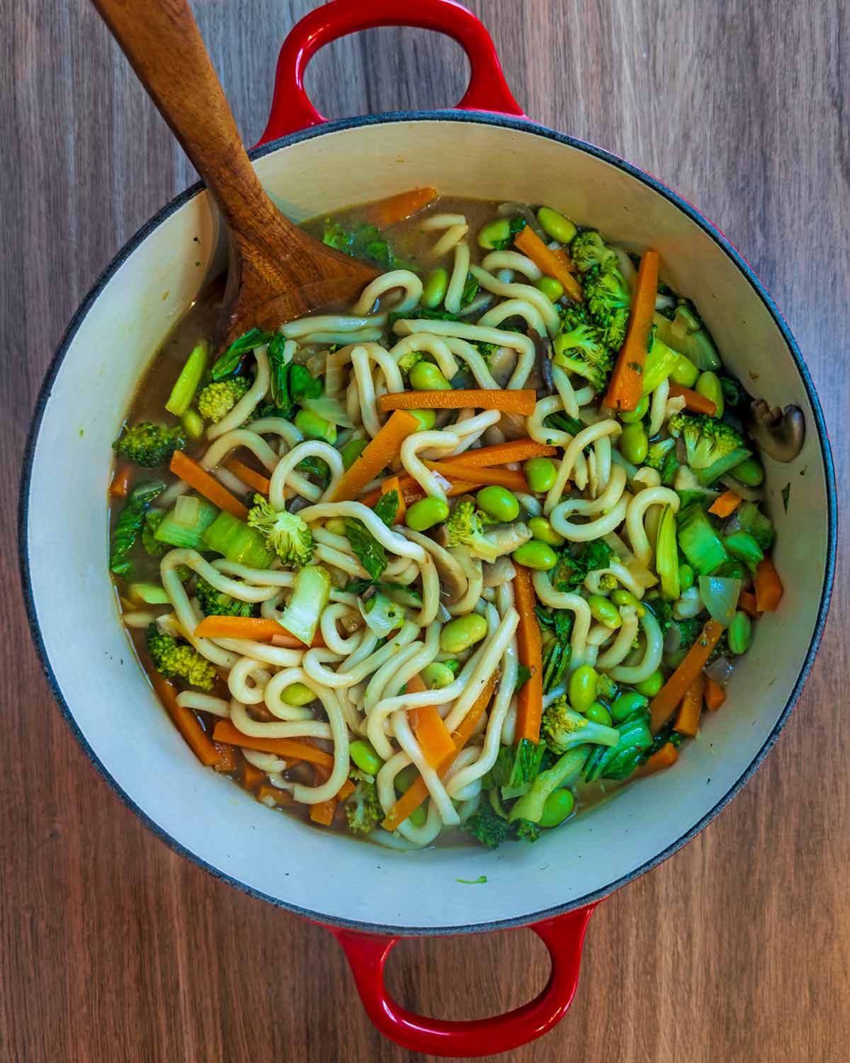 Udon noodles added to the pan.