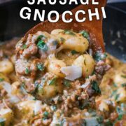Creamy sausage gnocchi with a text title overlay.