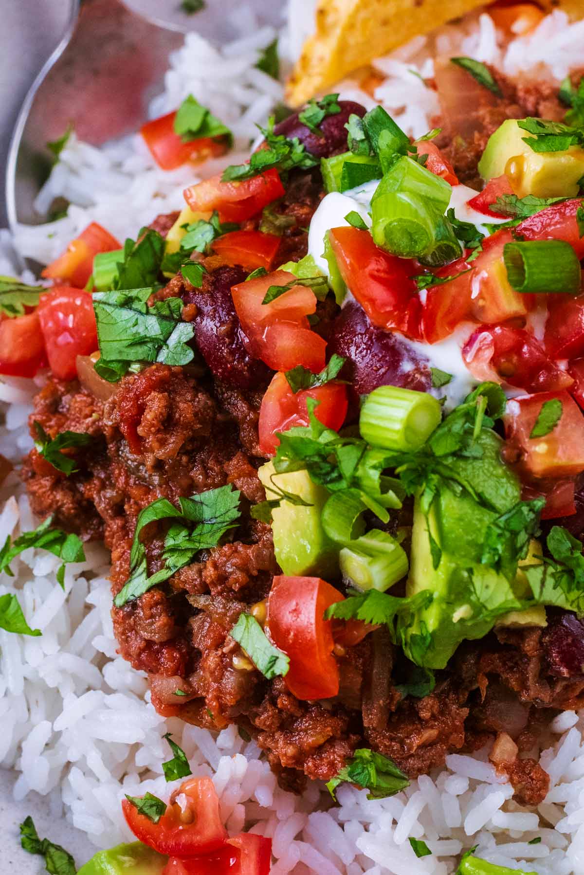 Beef chilli topped with chopped fresh tomatoes, diced avocado and coriander leaves.