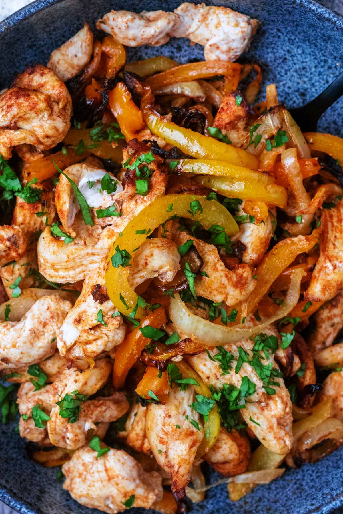 Cooked chicken, onions and peppers in a Mexican seasoning.